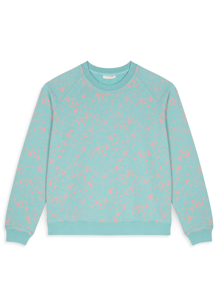 A mint green sweatshirt with vivid pink print allover it from Cub & Pudding